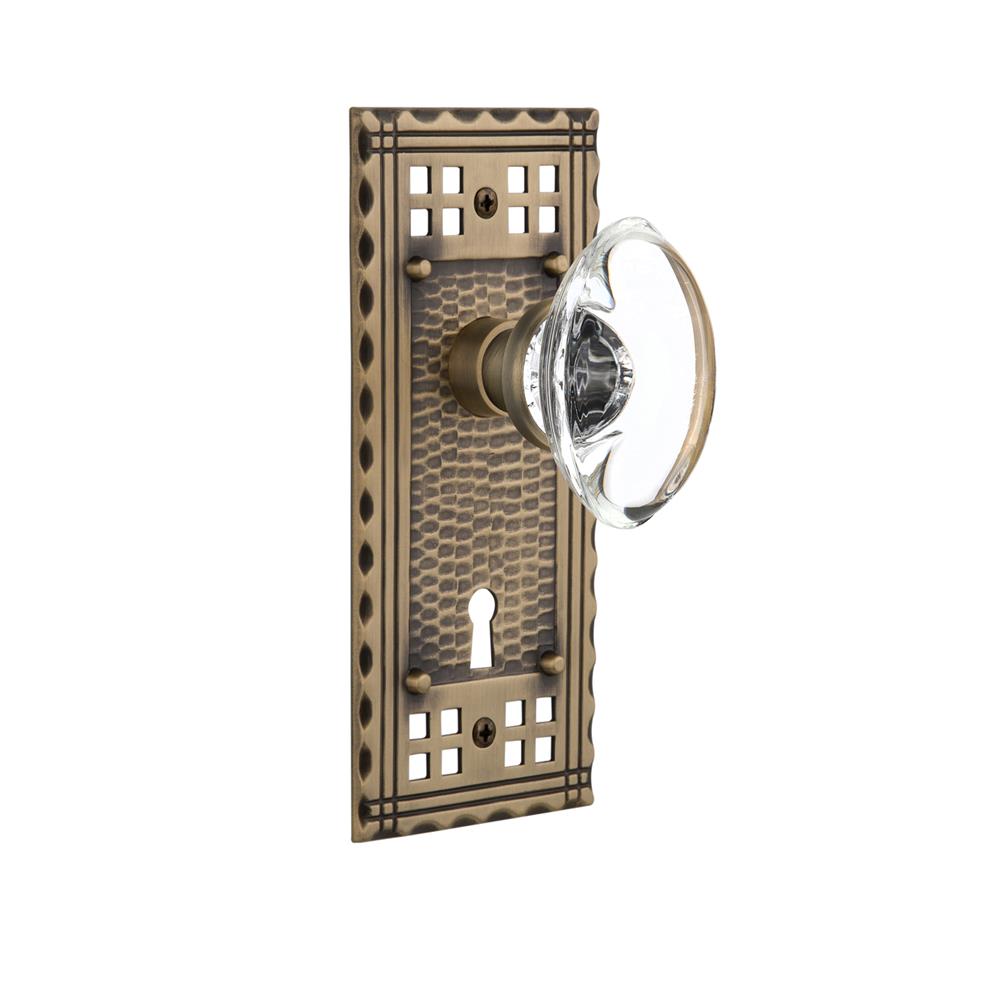Nostalgic Warehouse CRAOCC Single Dummy Knob Craftsman Plate with Oval Clear Crystal Knob and Keyhole in Antique Brass
